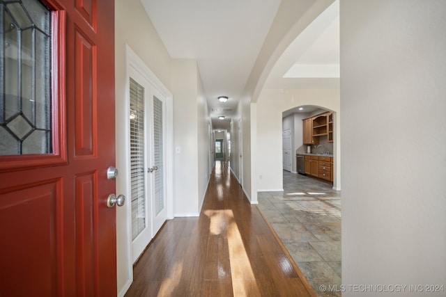 entrance foyer with sink and dark hardwood / wood-style floors