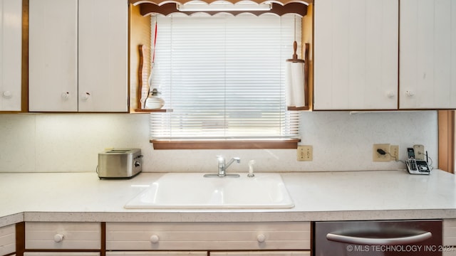 kitchen featuring sink and dishwasher