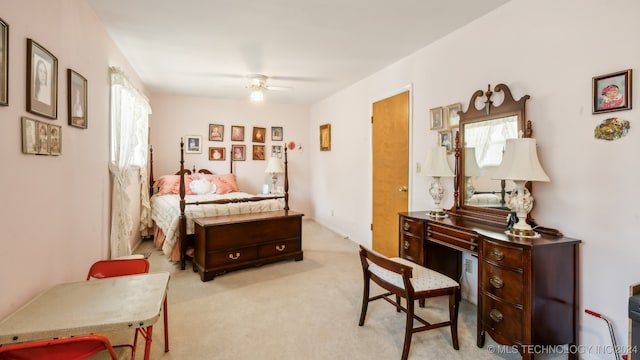 bedroom featuring light carpet and ceiling fan