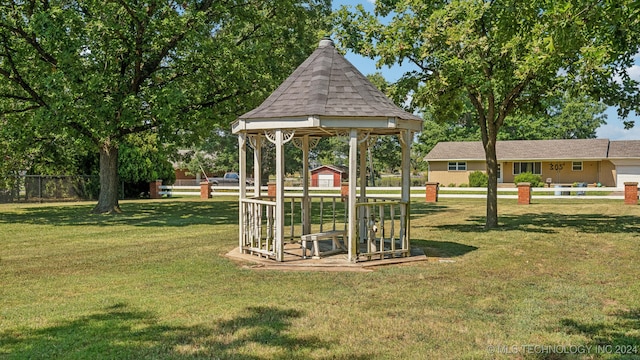 view of property's community with a yard and a gazebo