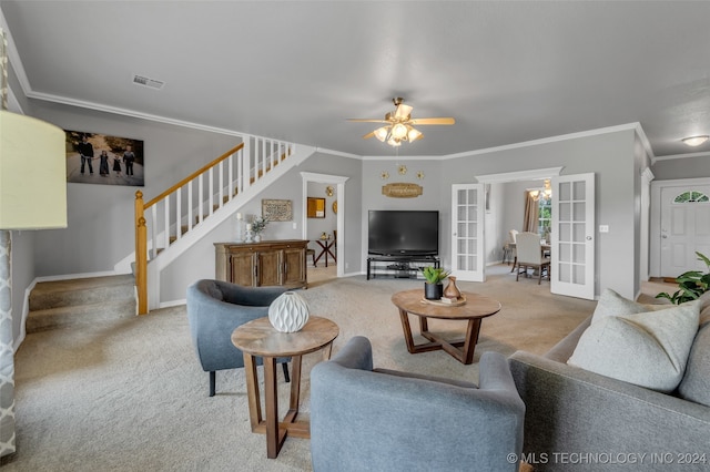 carpeted living room featuring ceiling fan, crown molding, and french doors