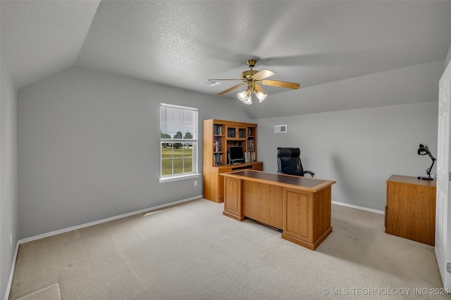 carpeted office space featuring a textured ceiling, ceiling fan, and lofted ceiling