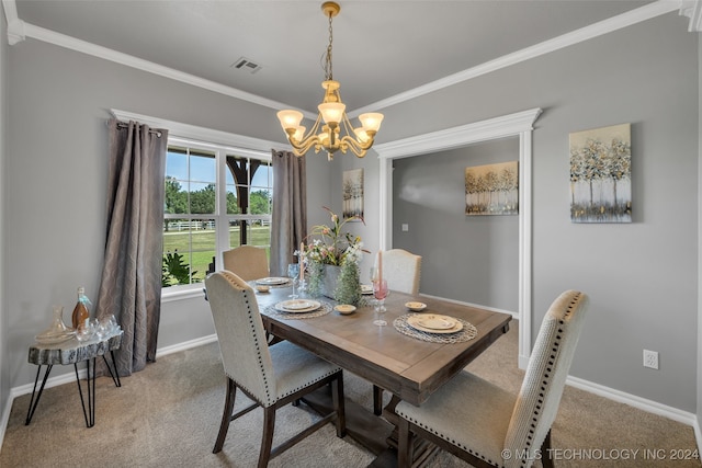 dining room with carpet flooring, a chandelier, and ornamental molding