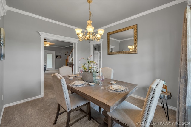 carpeted dining area featuring a notable chandelier and ornamental molding