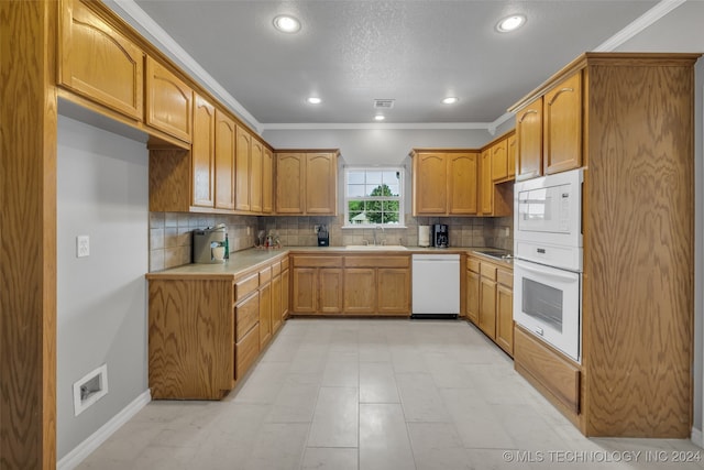 kitchen with decorative backsplash, ornamental molding, sink, white appliances, and light tile patterned flooring