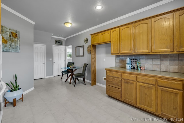 kitchen featuring tile counters, tasteful backsplash, crown molding, and light tile patterned flooring