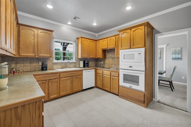 kitchen with light tile patterned floors, sink, decorative backsplash, and white appliances