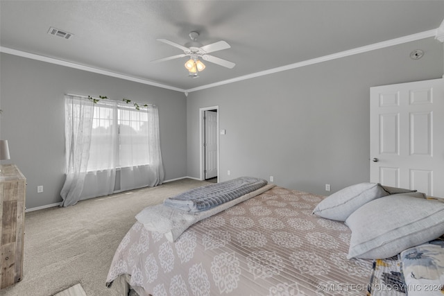 bedroom featuring light colored carpet, ornamental molding, and ceiling fan