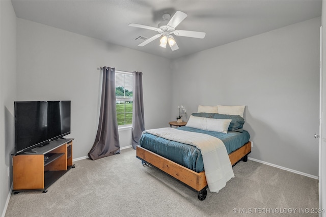 carpeted bedroom featuring ceiling fan