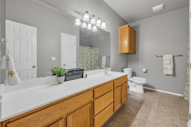 bathroom featuring tile patterned flooring, vanity, and toilet