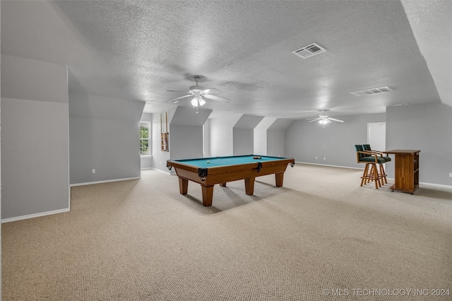 rec room with pool table, light colored carpet, a textured ceiling, and lofted ceiling