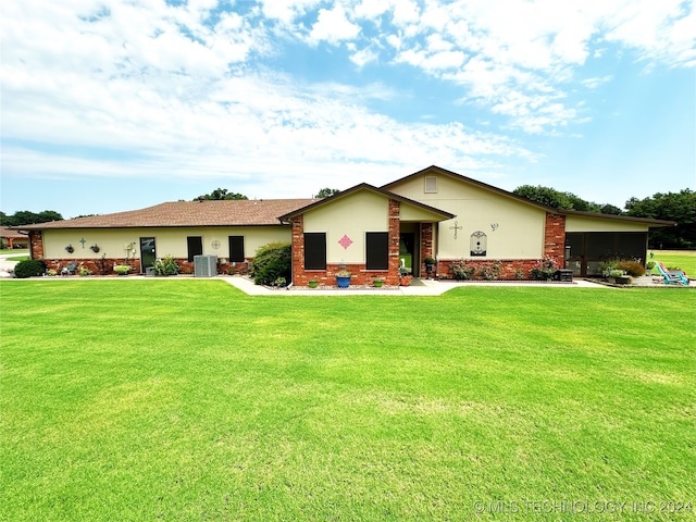 single story home with cooling unit and a front lawn