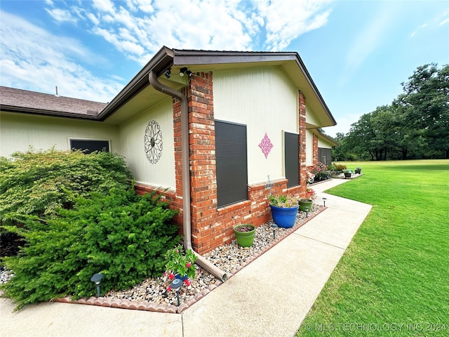 view of property exterior featuring a yard