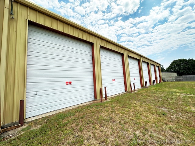 garage featuring a yard