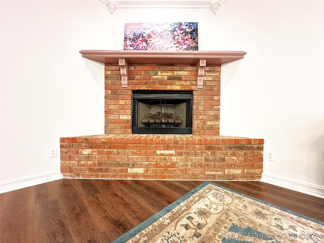 details with wood-type flooring and a fireplace