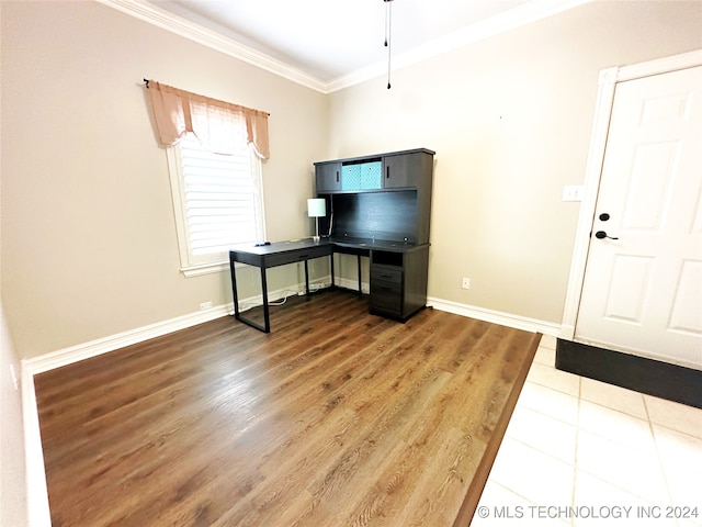 interior space with hardwood / wood-style floors and ornamental molding