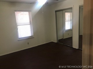 unfurnished room featuring ceiling fan