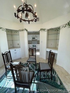 dining space with a high ceiling and an inviting chandelier