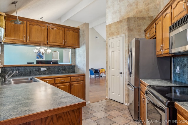 kitchen with appliances with stainless steel finishes, lofted ceiling with beams, sink, and a chandelier