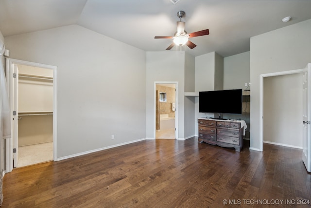 interior space with dark wood-type flooring, vaulted ceiling, and ceiling fan