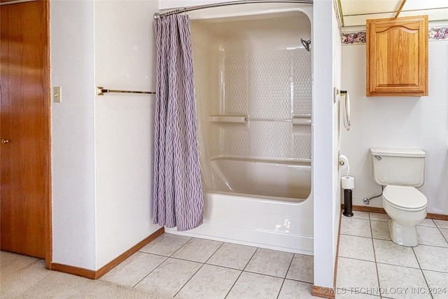 bathroom featuring shower / bath combo, tile patterned flooring, and toilet