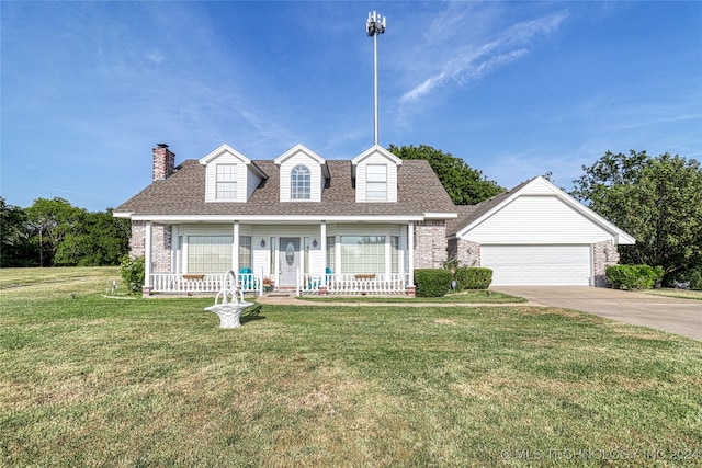 cape cod house featuring covered porch and a front yard