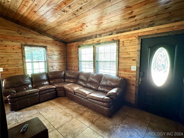 unfurnished living room with light tile patterned flooring, plenty of natural light, and wood ceiling