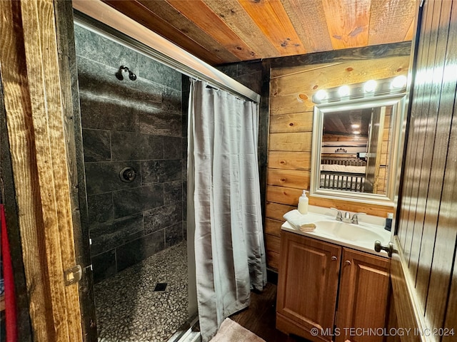 bathroom featuring wood walls, a shower with curtain, vanity, and wooden ceiling