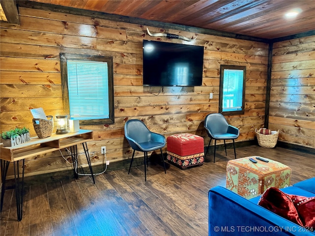 sitting room featuring hardwood / wood-style floors and wood ceiling