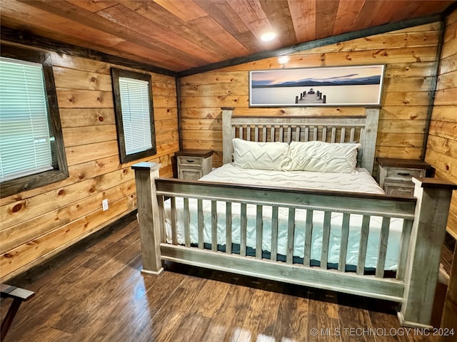 bedroom with wooden ceiling, hardwood / wood-style flooring, wood walls, and lofted ceiling