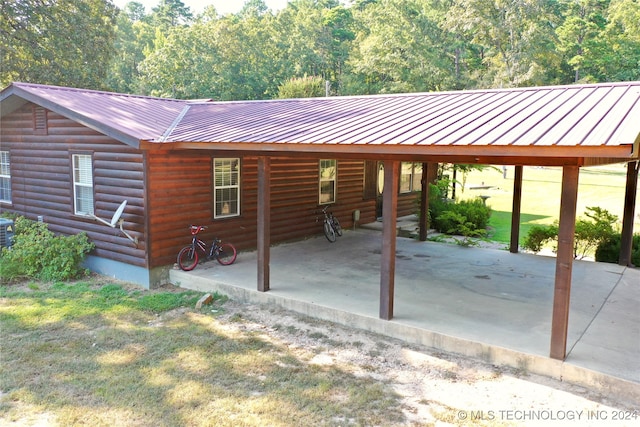 view of front facade featuring central AC unit and a patio area