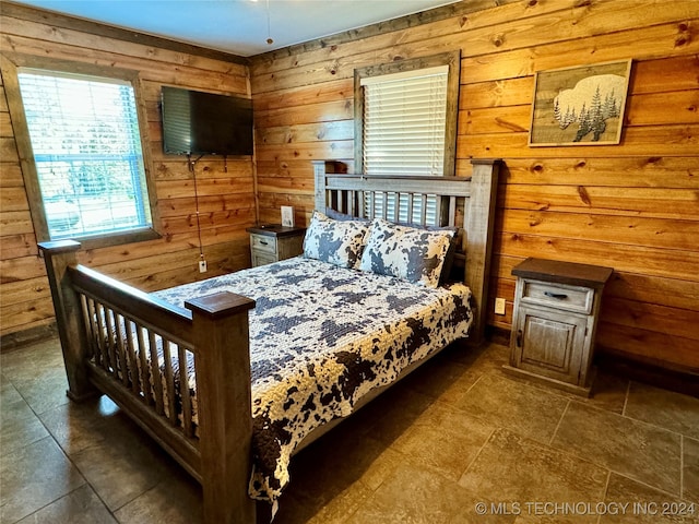 tiled bedroom with wooden walls