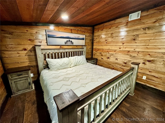 bedroom featuring dark hardwood / wood-style floors, wood walls, lofted ceiling, and wood ceiling