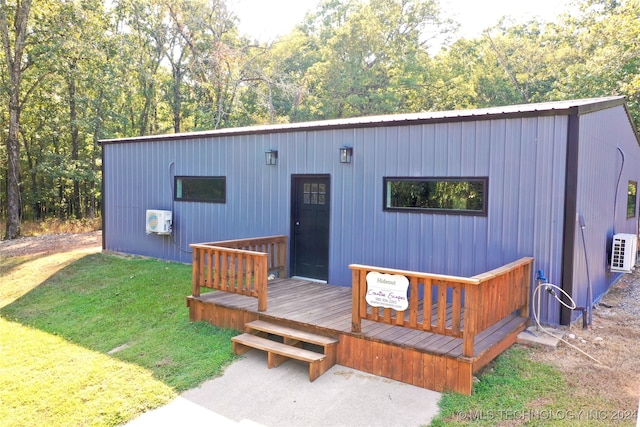 view of front of property with a front yard and a deck