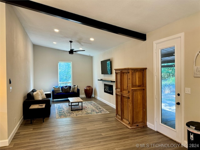 living room with ceiling fan, beam ceiling, and dark hardwood / wood-style floors