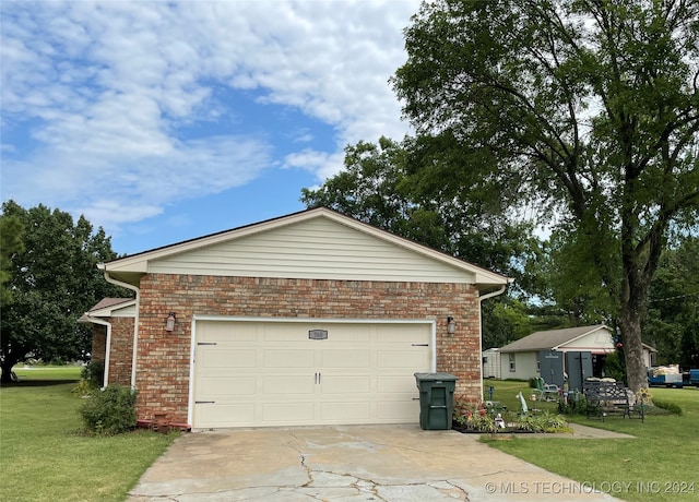 view of property exterior featuring a yard and a garage