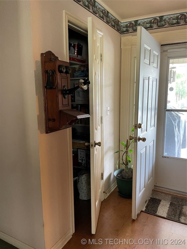 760 N Quapaw St N, Skiatook, OK 74070 - doorway to outside featuring wood-type flooring