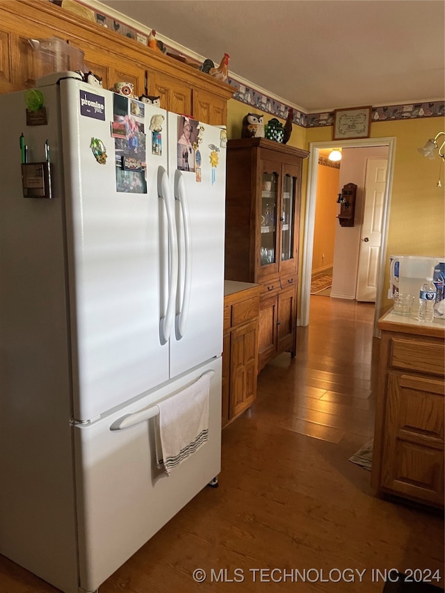 kitchen with wood-type flooring and white fridge