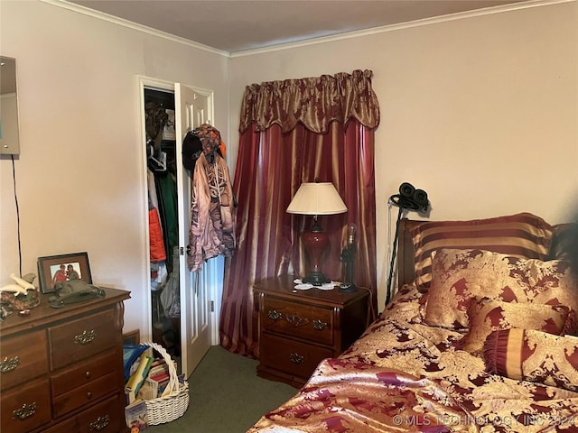 bedroom with crown molding, carpet flooring, and a closet