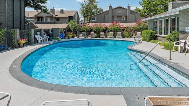 view of swimming pool with a patio area