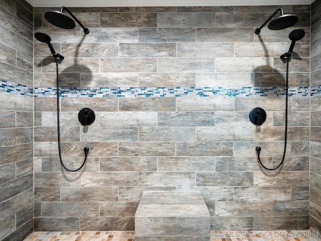 bathroom with a tile shower