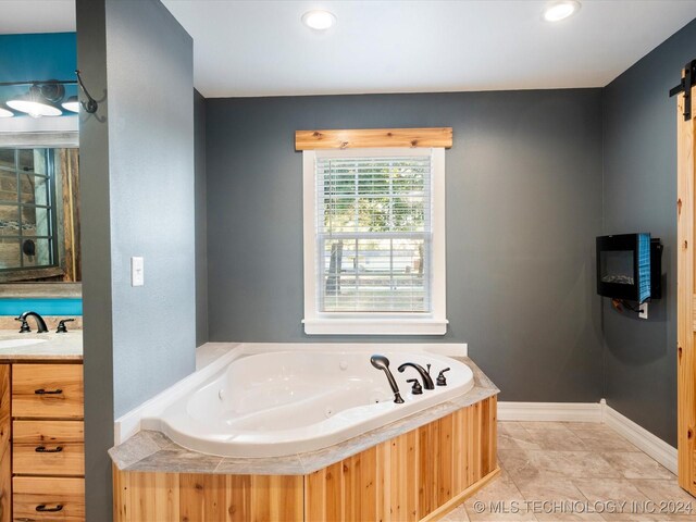 bathroom featuring vanity, a shower with shower door, and wood walls