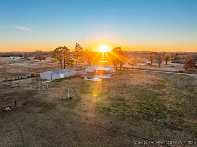 yard at dusk with an outbuilding