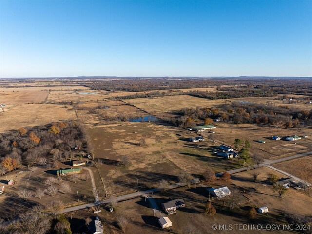 birds eye view of property featuring a rural view