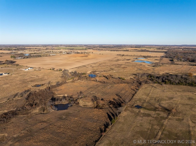 birds eye view of property with a rural view