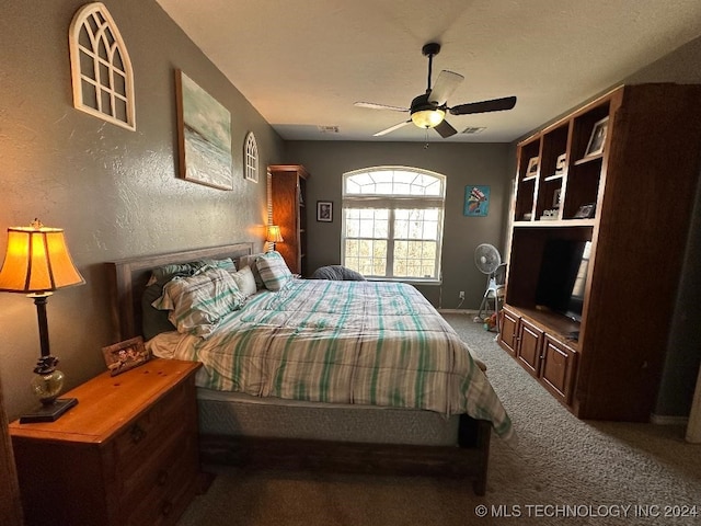 bedroom featuring ceiling fan and carpet flooring