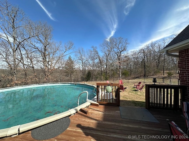 view of pool featuring a wooden deck