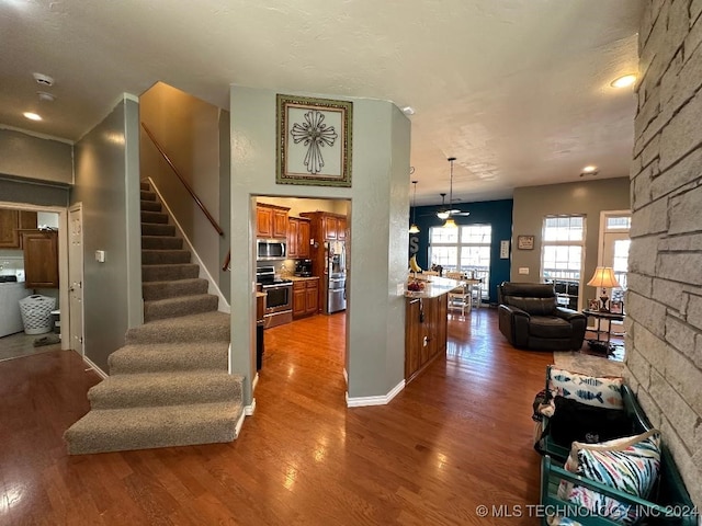 interior space featuring hardwood / wood-style floors and ceiling fan