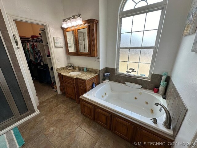 bathroom with vanity and tile patterned flooring