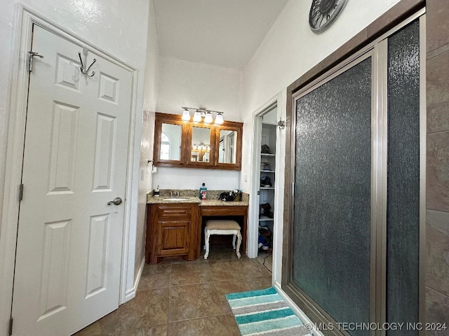 bathroom with vanity and tile patterned flooring